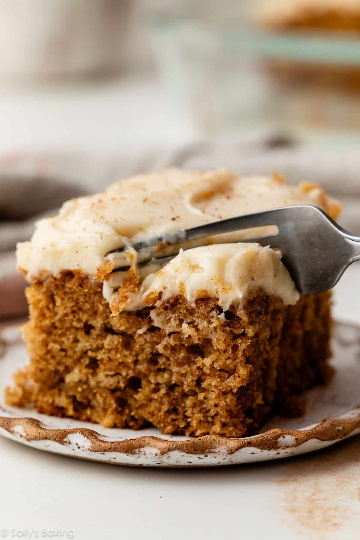 piece of spice cake with brown butter cream cheese frosting.