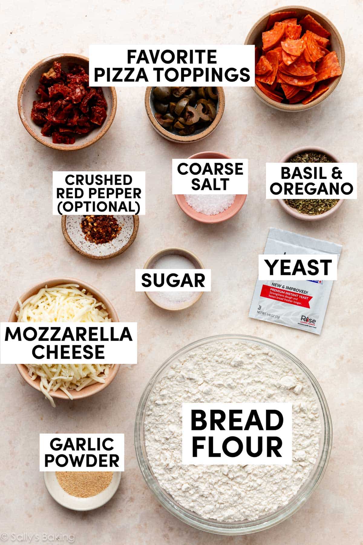 ingredients measured out including bread flour, sugar, salt, herbs, garlic powder, and pepperoni.