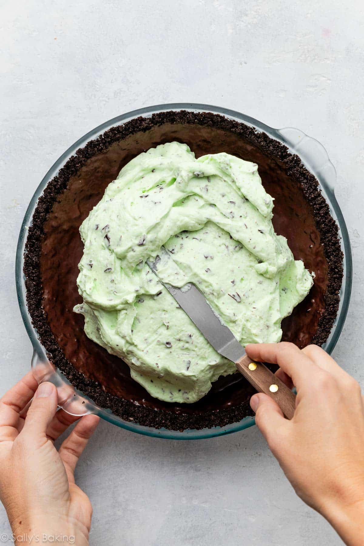 spreading filling into crust.