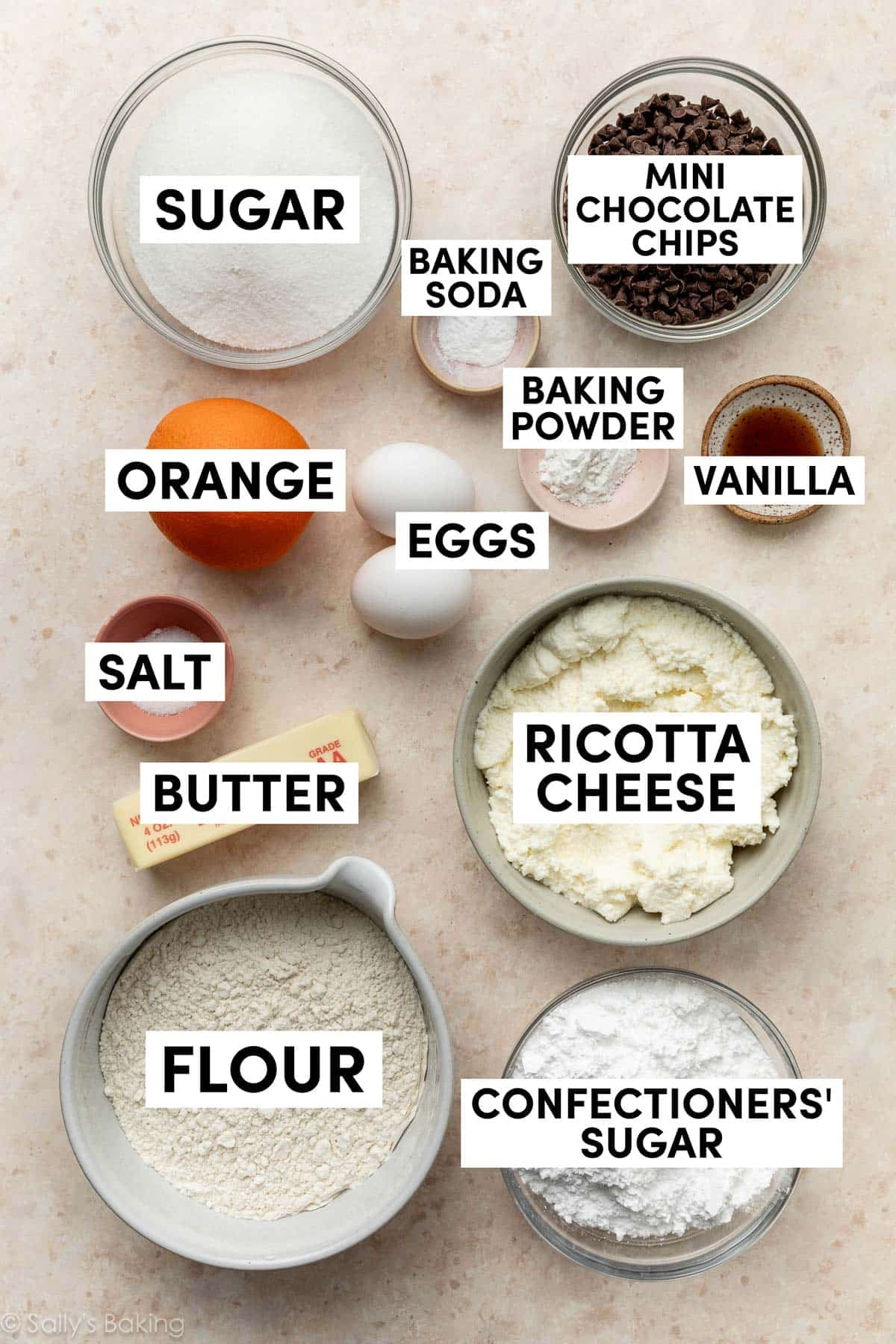 ingredients in bowls including ricotta cookies, eggs, flour, confectioners' sugar, sugar, and eggs.