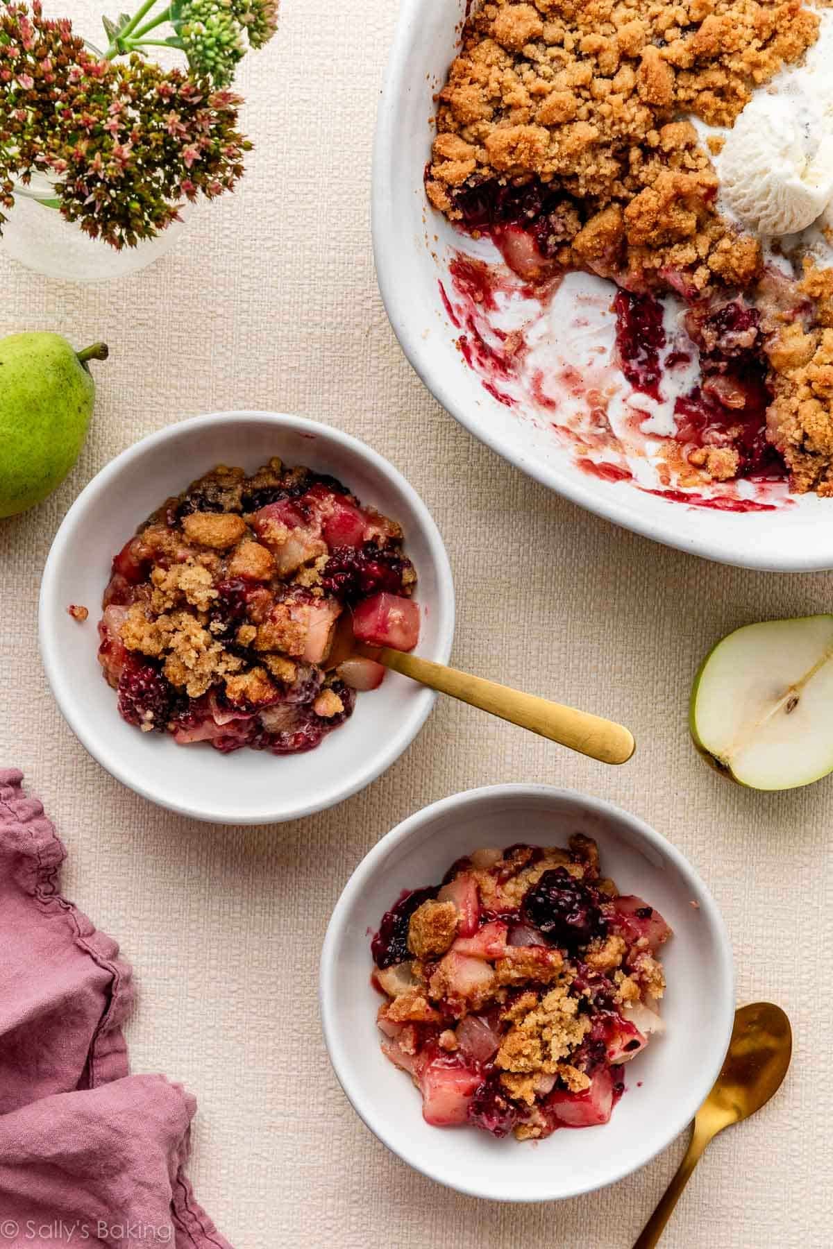 pear blackberry crumble in bowls.