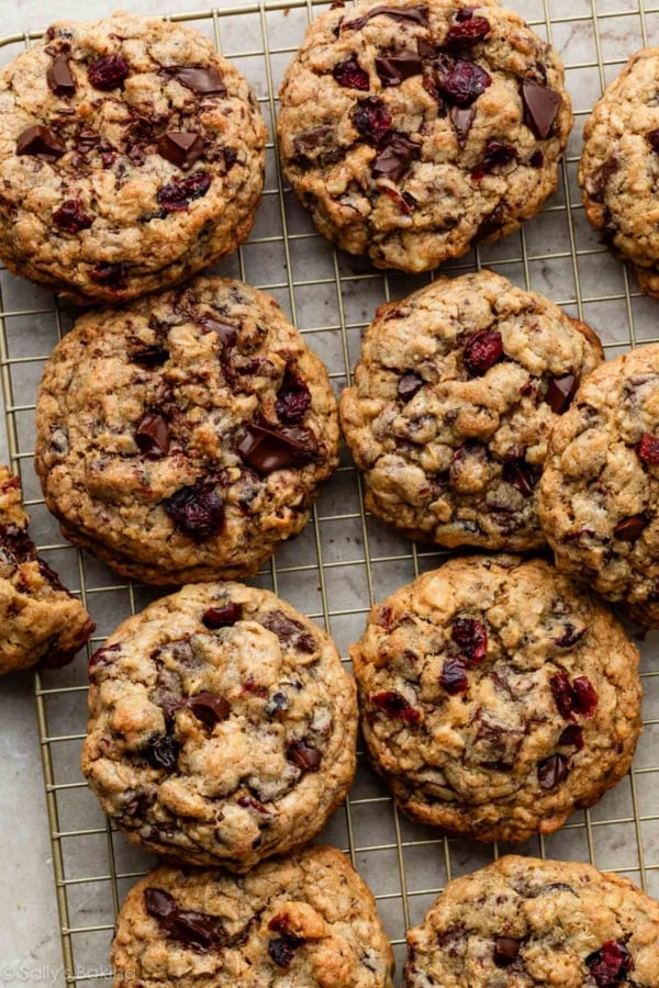 big fat dark chocolate cranberry oatmeal cookies on cooling rack.