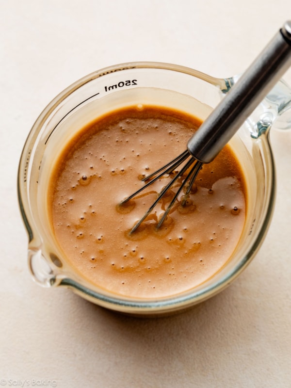 espresso icing in liquid measuring cup.