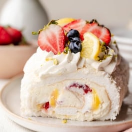 meringue roulade with fresh berries and lemon curd.