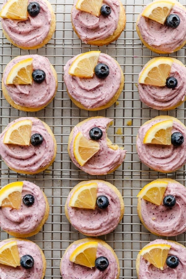 frosted lemon blueberry cookies on cooling rack.