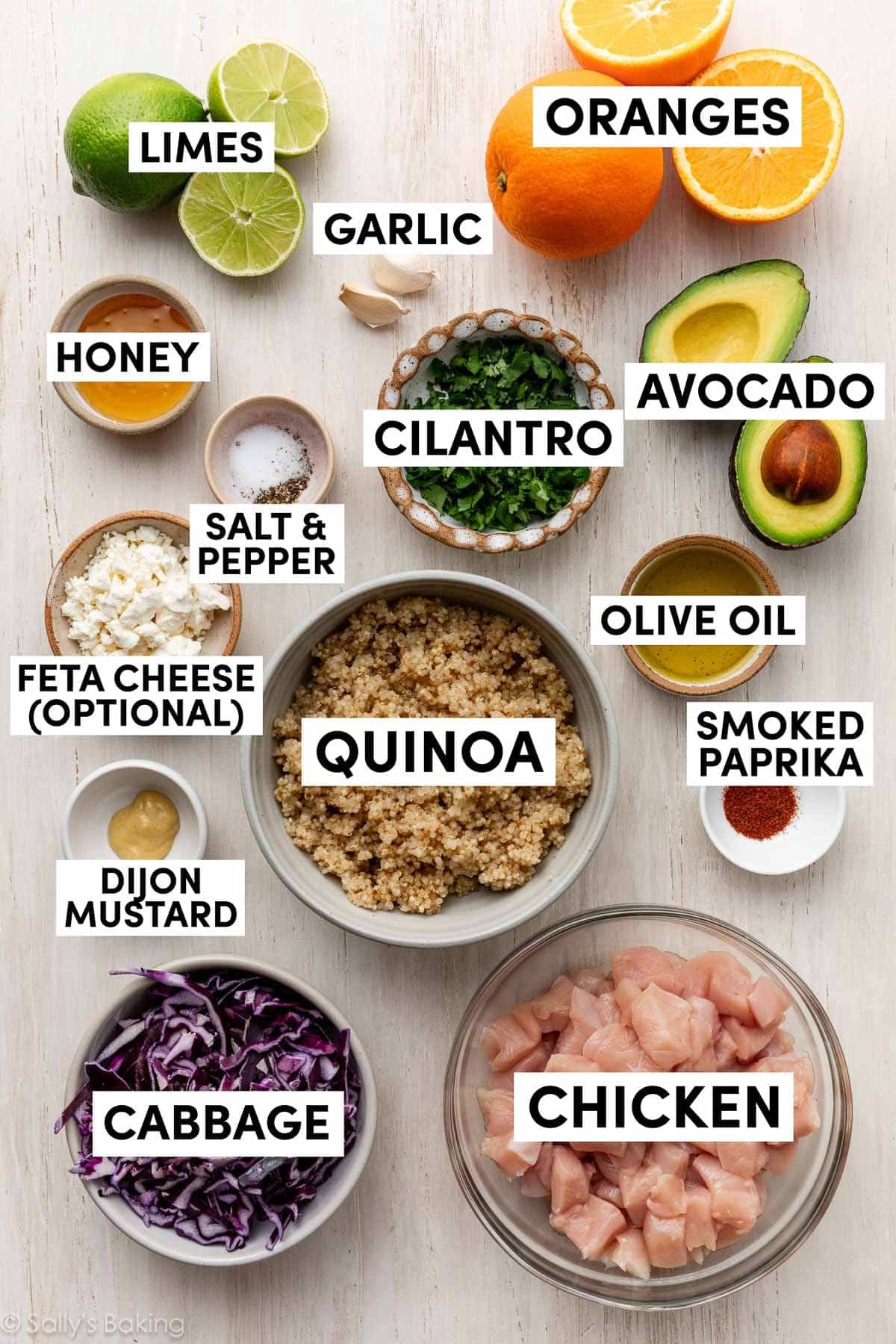 ingredients in bowls including cabbage, chicken, feta cheese, and honey.